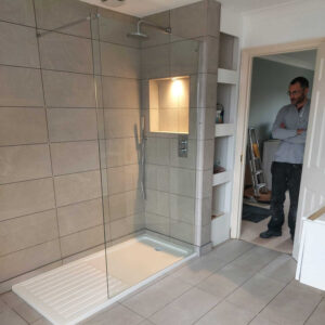 Professional walk-in shower and glass enclosure installation by Karl Andy Plumbing.