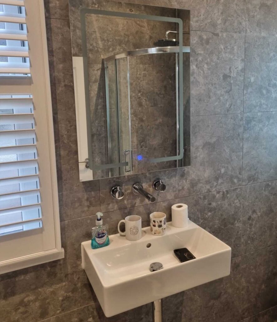 High-end floating basin and LED mirror installation in Bromley by Karl Andy Plumbing.