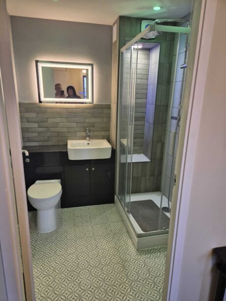 Complete bathroom renovation and tiling by Karl Andy Plumbing featuring modern shower and vanity.